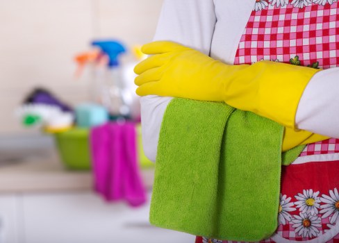 Professional carpet cleaning staff following health and safety procedures